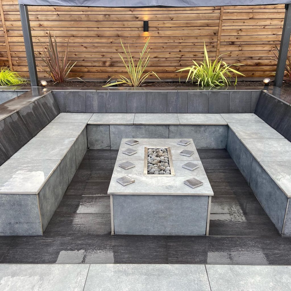 Outdoor seating area with fire pit installed in Warrington by Taylor'd Landscapes